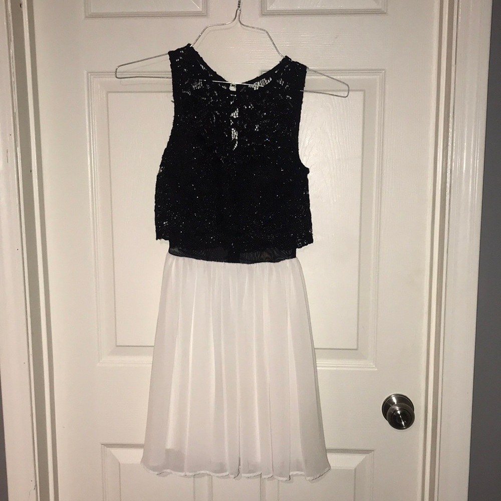Beautiful black lace and off white cocktail dress by Jodi Kristopher size 1.